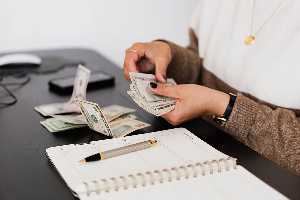 self-employed-holding-money self-employed woman counting money